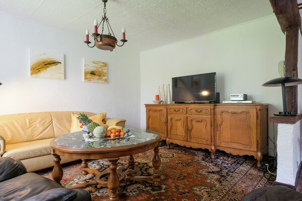 Foto van Appartement in boerderij met eigen tuin, speeltoestellen en panoramisch uitzicht - LivingRoom