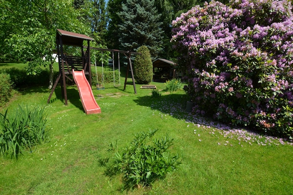 Foto van Bosontsnapping met tuin - Vakantiehuis in Staré Křečany - GardenSummer