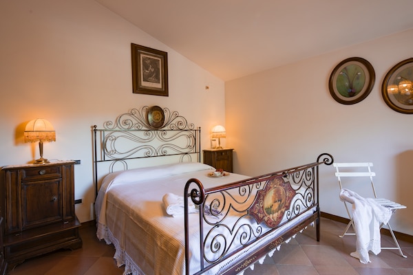 Foto van Villa in Toscane met Privézwembad en Uitzicht - Vakantiehuis in Castiglion Fiorentino - BedRoom