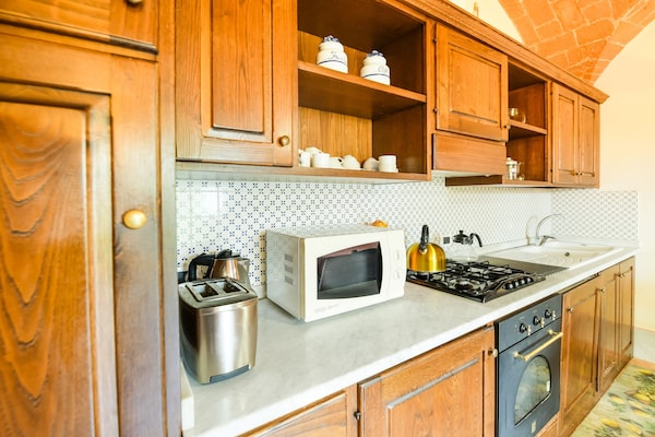 Foto van Villa in Toscane met Zwembad & Olijfbomen - Vakantiehuis in Cortona - Kitchen