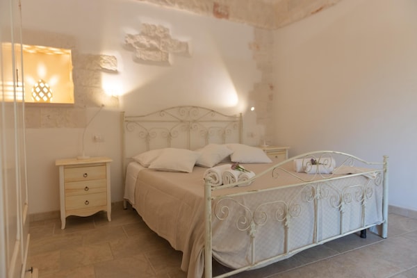 Foto van Villa in Itria-vallei met Infinity Pool - Vakantiehuis in Cisternino - BedRoom