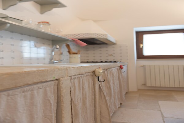 Foto van Trullo in Puglia met Zwembad en Uitzicht - Vakantiehuis in Ostuni - Kitchen