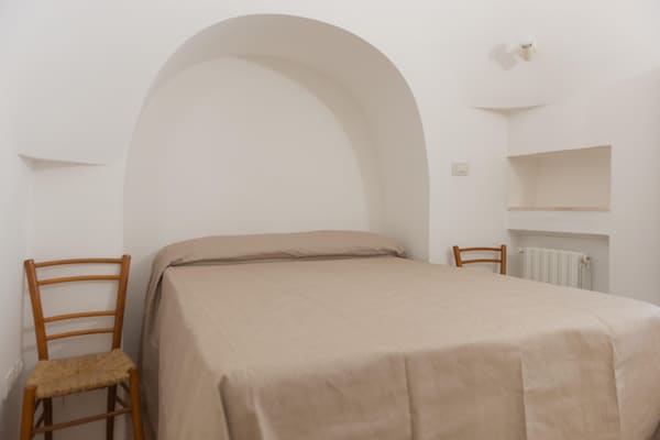 Foto van Trullo in Puglia met Zwembad en Uitzicht - Vakantiehuis in Ostuni - BedRoom