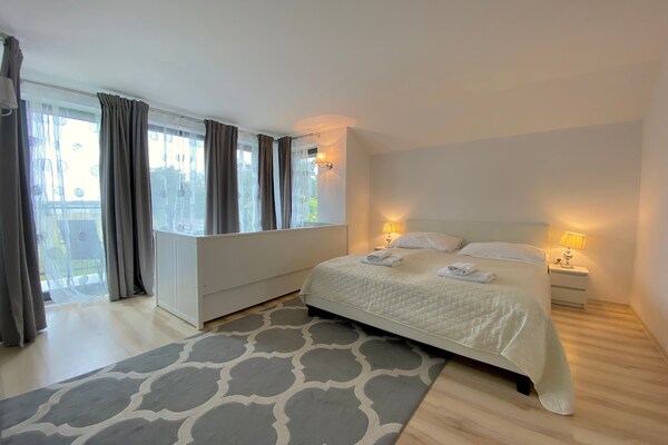 Foto van Vakantiehuis in Dziwnowek met Zwembad en Strand - Vakantiehuis in Dziwnowek - BedRoom