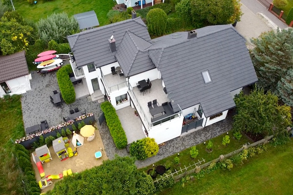 Foto van Vakantiehuis in Dziwnowek met Zwembad en Strand - Vakantiehuis in Dziwnowek - ExteriorSummer
